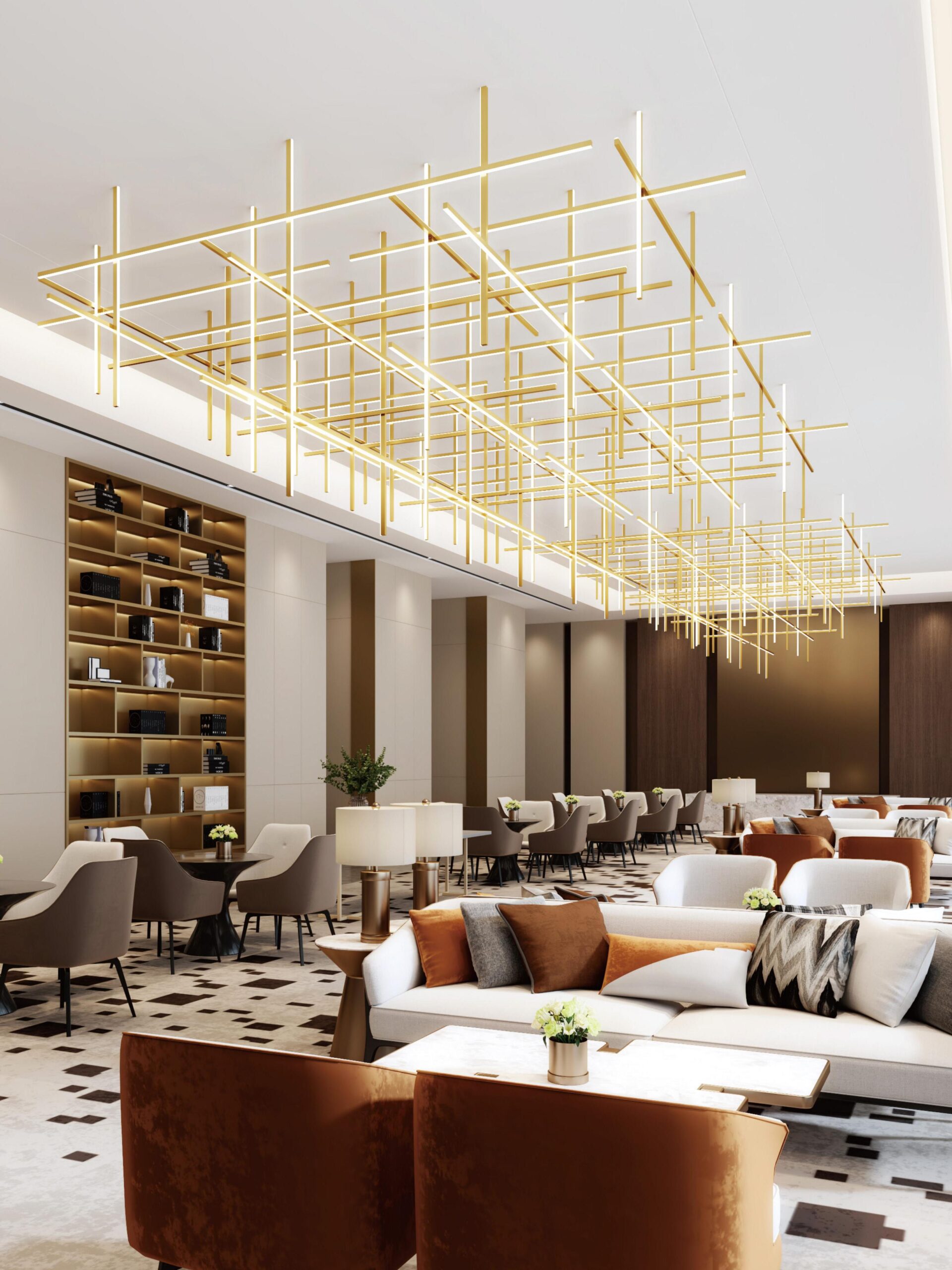Large gold tubular pendant lighting in a luxury lobby.