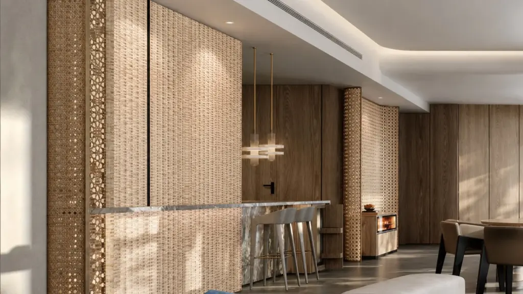 Warm hotel interior with decorative pendant lighting above a lounge seating area.