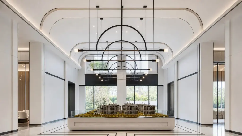 Coordinated dark metal suspended luminaires repeated along a bright contemporary interior, showing consistent visible finishes