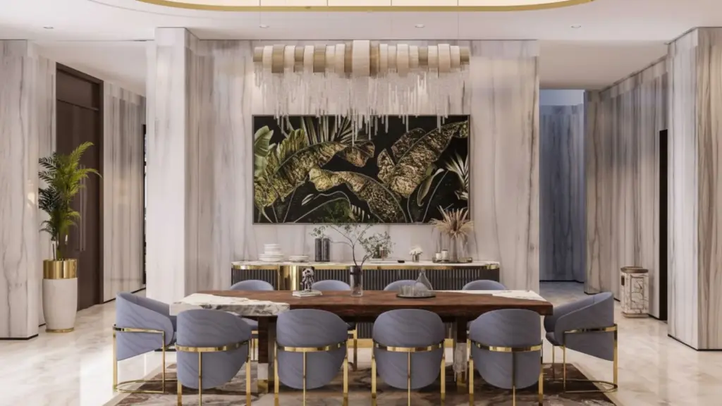 Customer-provided dining-room image with a linear gold-and-crystal pendant above a table, coordinated gold details and pale marble surfaces.
